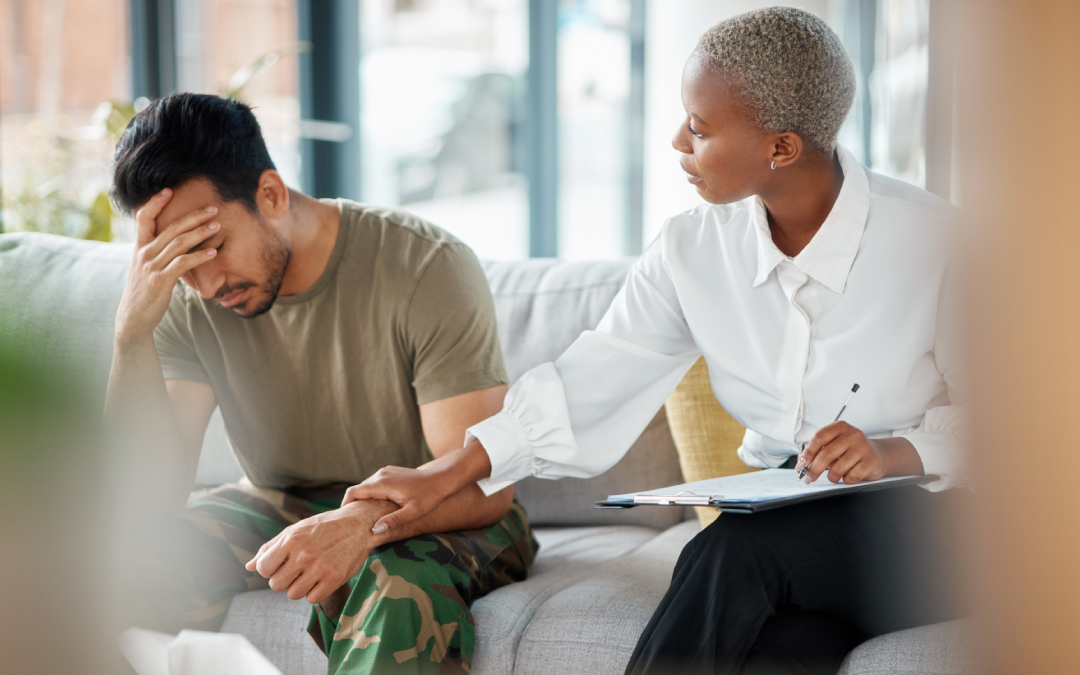 A compassionate therapist offering supportive touch to a distressed client during a trauma-informed therapy session at Choice Point Psychological in Calgary.